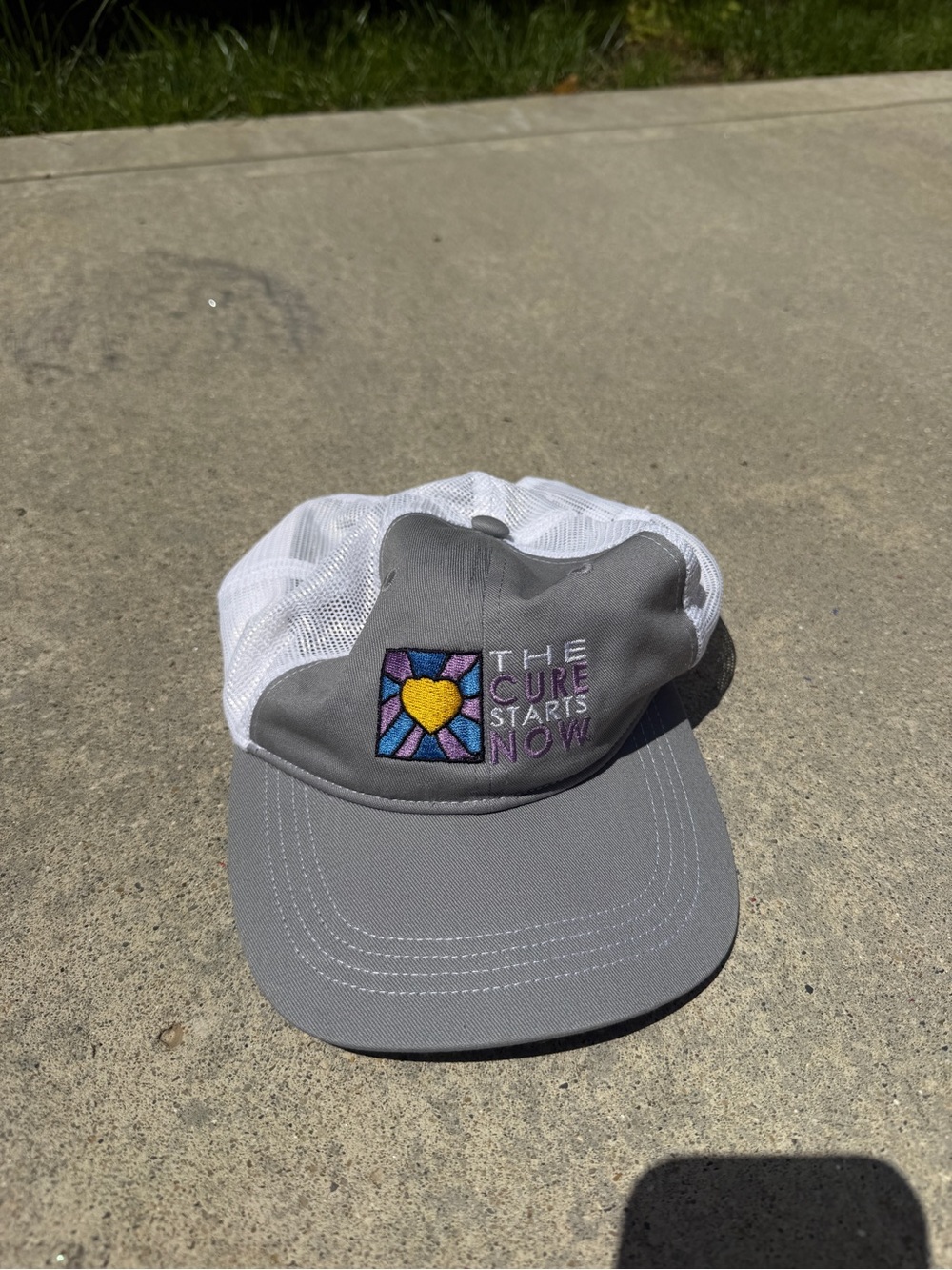 Gray and White Kids Trucker Hat with Colorful Heart Patch - The Cure Starts Now